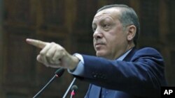 Turkey's Prime Minister Tayyip Erdogan addresses members of parliament, Ankara, Oct. 11, 2011.