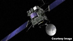 FILE - Artist view of the Rosetta spacecraft. Rosetta’s lander, Philae, is attached and is shown in blue (© ESA/J. Huart)