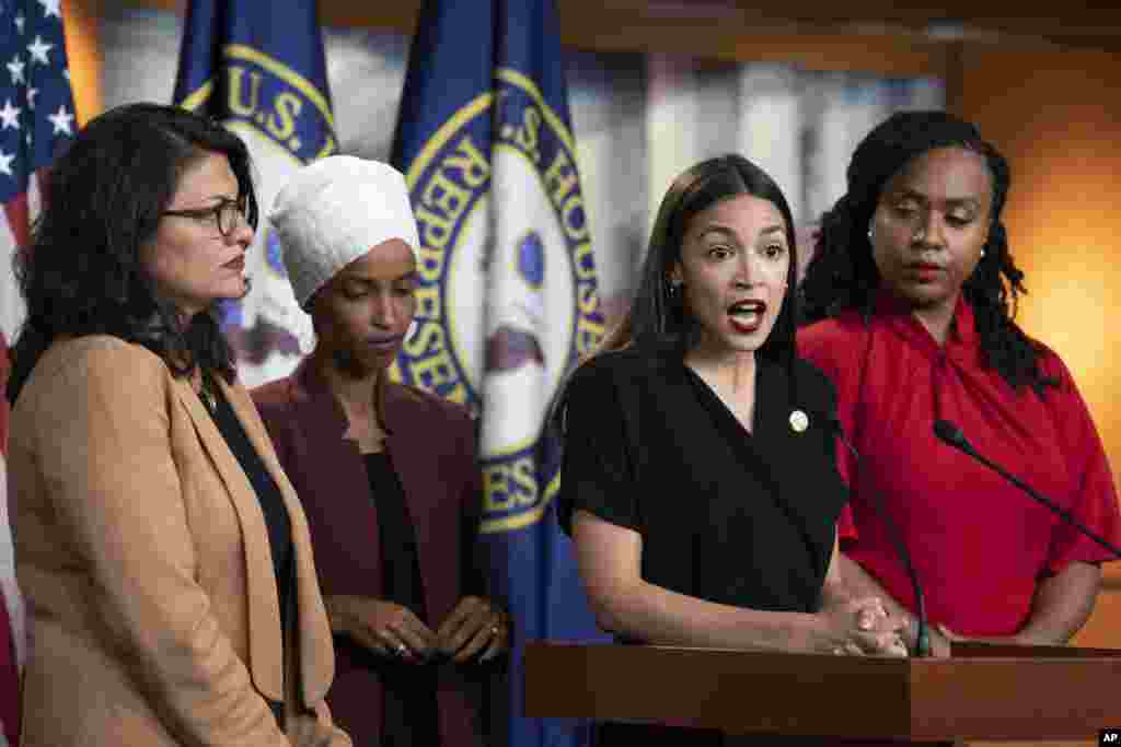 U.S. Rep. Alexandria Ocasio-Cortez, D-N.Y., speaks as, from left, Rep. Rashida Tlaib, D-Mich., Rep. Ilhan Omar, D-Minn., and Rep. Ayanna Pressley, D-Mass., listen during a news conference at the Capitol in Washington, July 15, 2019. President Donald Trump intensified his incendiary comments about the four Democratic congresswomen of color, urging them to get out if they don't like things going on in America.