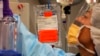 FILE - Chemotherapy medicine is readied for a cancer patient at the National Institutes of Health in Bethesda, Maryland, March 24, 2009.