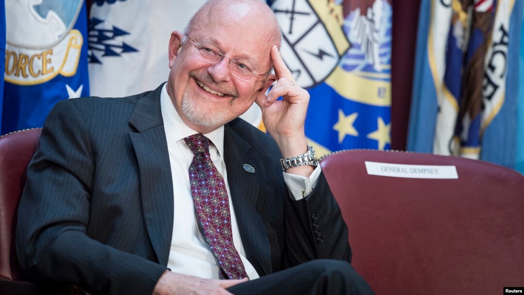FILE - Director of National Intelligence James R. Clapper listens during a retirement ceremony at the National Security Agency in Fort Meade, Maryland, March 28, 2014.