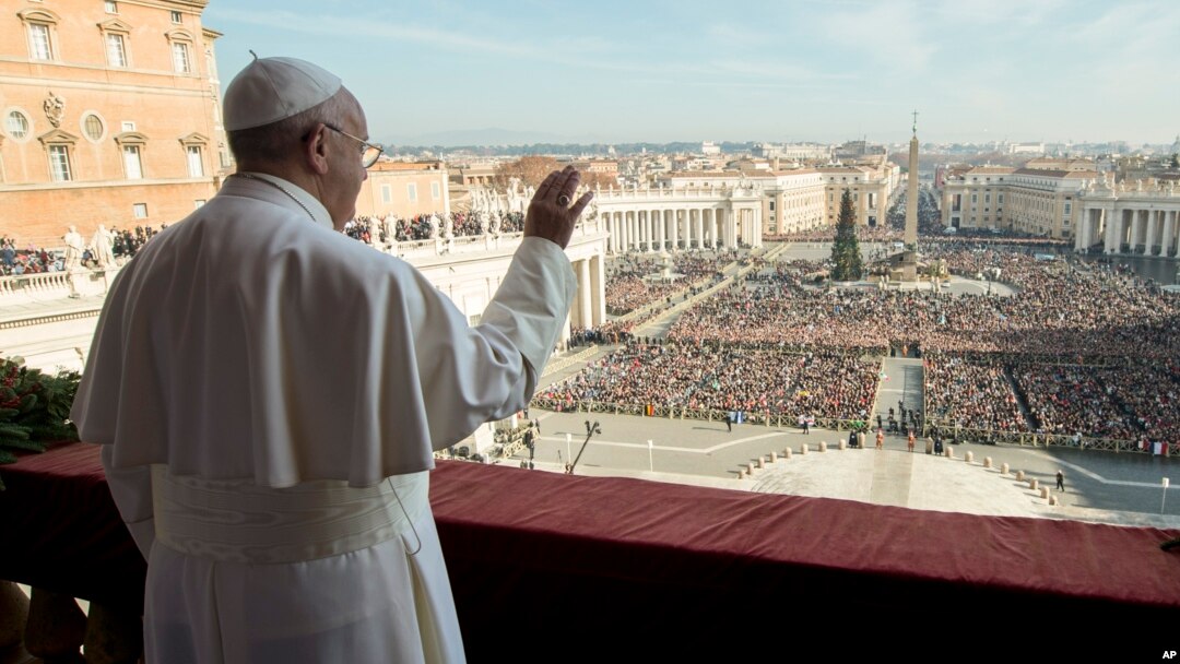 Pope Francis delivers his "Urbi et Orbi" (to the city and to the world) blessing from the central balcony of St. Peter's Basilica at the Vatican, Dec. 25, 2015. 