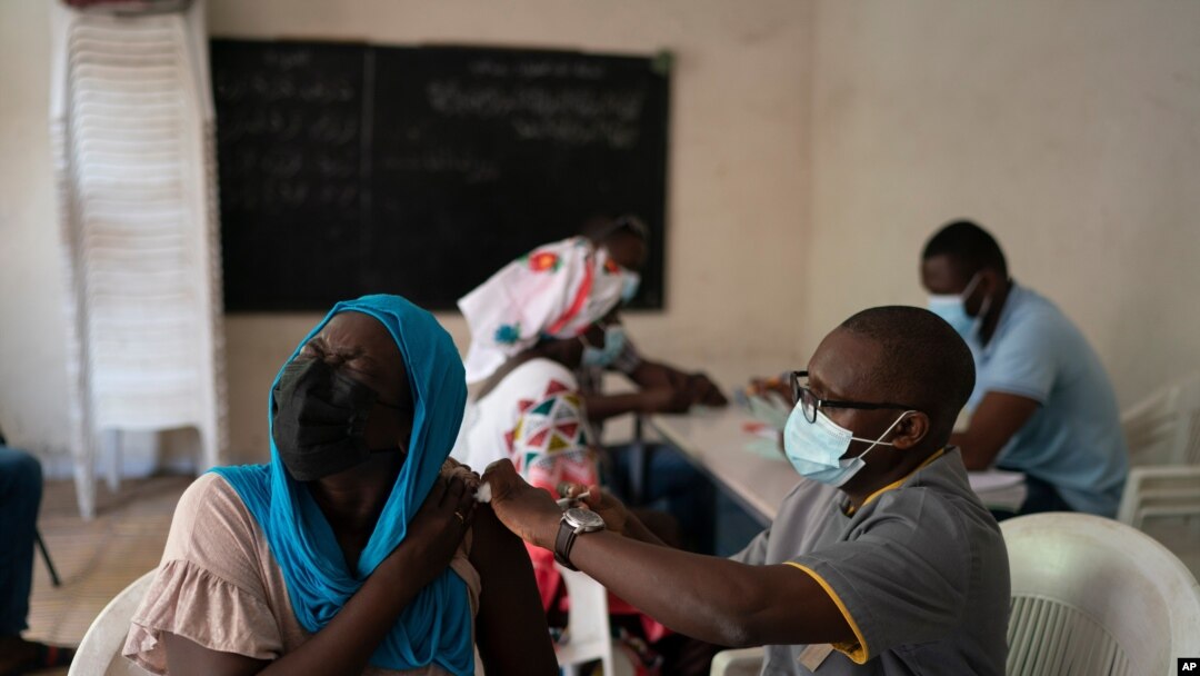 FILE - A health worker administers a dose of Johnson & Johnson's COVID-19 vaccine at Dakar's Medina neighborhood, Senegal, July 28, 2021.