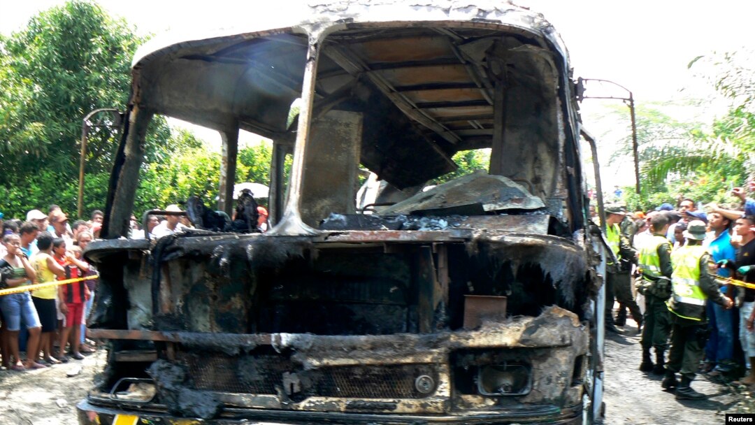 The charred remains of a bus, in which 31 children died, is seen in Fundacion, northern Colombia, May 18, 2014.