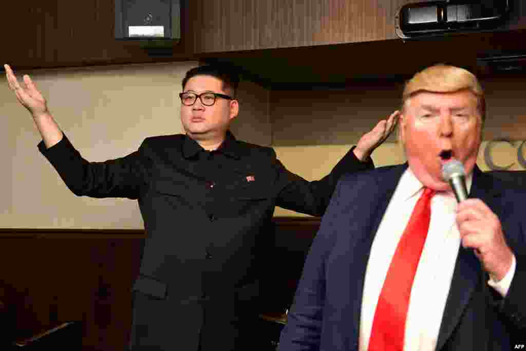 Impersonators of North Korean leader Kim Jong Un (L) and U.S. President Donald Trump perform at a bar in Osaka, ahead of the G-20 summit.