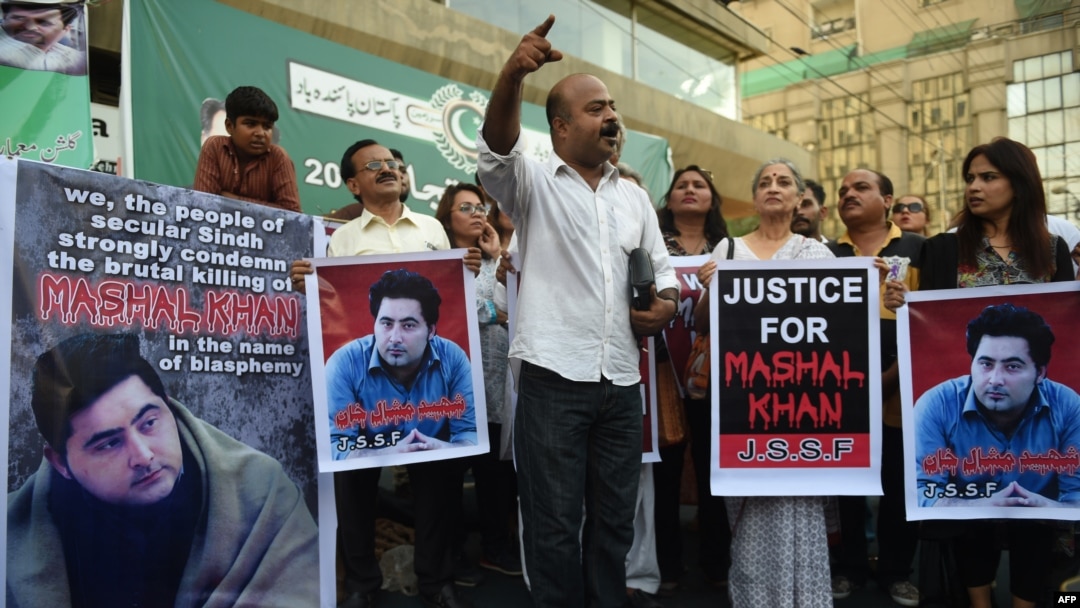 FILE - Pakistani demonstrators take part in a protest over the killing of journalism student Mashal Khan in Karachi, April 22, 2017. Pakistan police arrested 22 people after the lynching of the student accused of blasphemy.