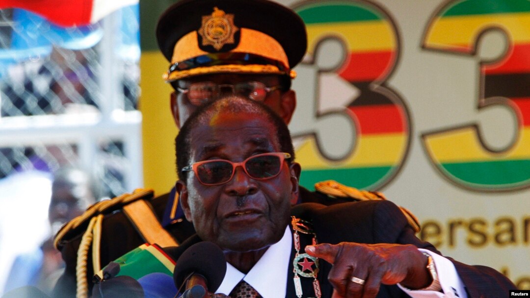 Zimbabwe President Robert Mugabe addresses crowds gathered for the country's 33rd independence celebrations at the National Sports stadium in Harare, April 18, 2013.