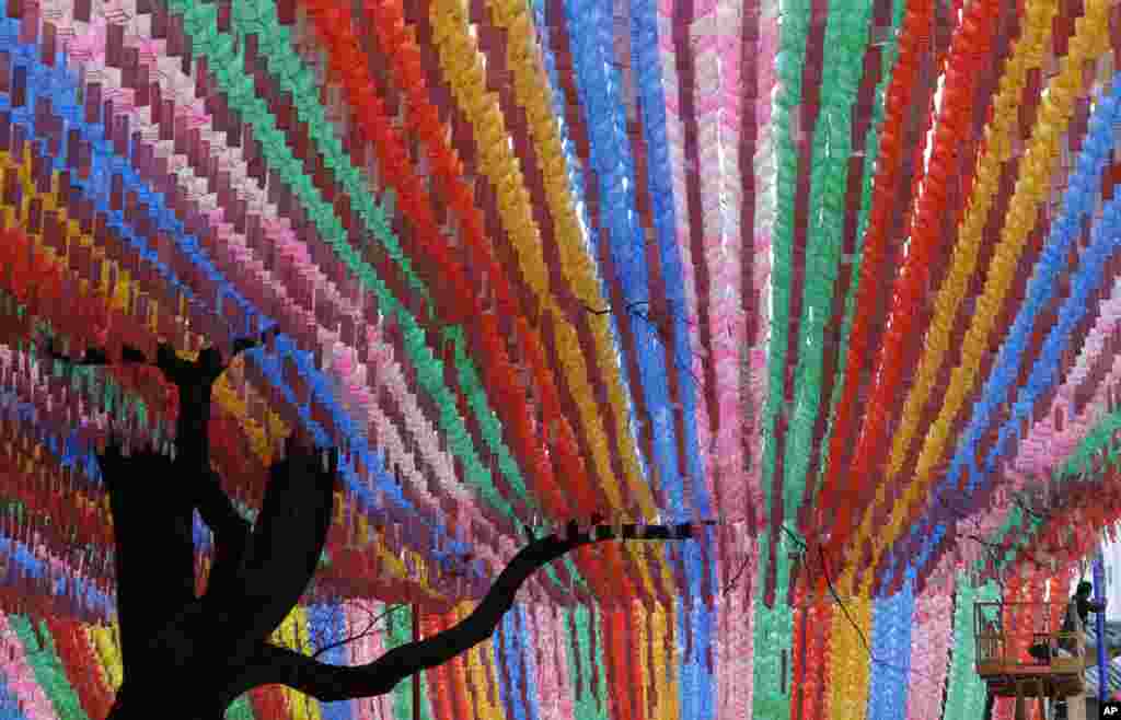 A man works near lanterns in preparation for the upcoming celebration of Buddha's birthday at the Jogye temple in Seoul, South Korea.