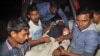 A man injured in an attack on a Shi'ite mosque is carried for treatment in Bogra district, Bangladesh, Nov. 26, 2015.