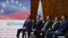 FILE - Chevron President in Venezuela, Javier La Rosa, left, attends a signing agreement ceremony between Venezuela and the California-based Chevron, in Caracas, Venezuela, Dec. 2, 2022.