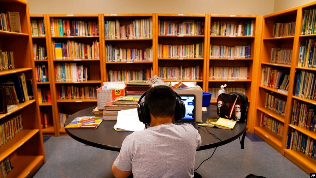 FILE - In this Aug. 26, 2020, photo, a Los Angeles Unified School District student attends an online class at Boys & Girls Club of Hollywood in Los Angeles.