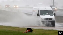 Accumulated rain from what became Tropical Depression Gordon makes for a big splash as this service van makes its way across a frontage road along Interstate 55 in Jackson, Miss., Sept. 5, 2018. Weather forecasts have much of the central part of the state dealing with Gordon's rain until the weekend.