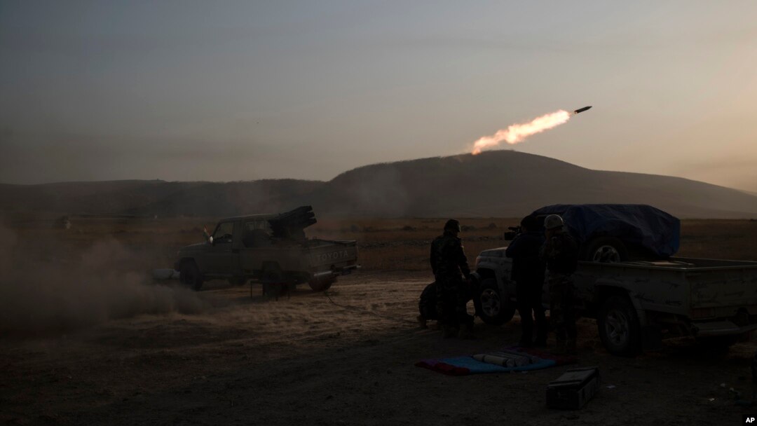 Kurdish Peshmerga soldiers fire artillery at Islamic State positions in Bashiqa, east of Mosul, Iraq, Nov. 7, 2016.