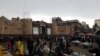 People shop outside the gates to the Old City in Sana'a on May 7, 2020.