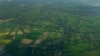 FILE - Farmers' fields are seen above Gatwick airport near London, Britain.