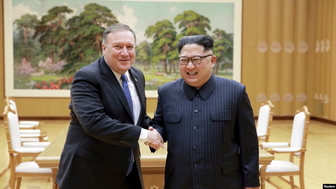 North Korean leader Kim Jong Un shakes hands with U.S. Secretary of State Mike Pompeo, May 9, 2018, released by North Korea's Korean Central News Agency (KCNA) in Pyongyang.