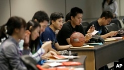 FILE - Students attend a new student orientation at the University of Texas at Dallas in Richardson, Texas.