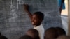 A young boy during a lesson at the Mugosi Primary School, in the Kahe refugee camp, in northeastern Democratic Republic of the Congo. (UNESCO/M.Hofer)