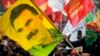 FILE - A youth holds a flag with the image of Abdullah Ocalan, the jailed leader of the rebel Kurdistan Workers' Party, or PKK, in Istanbul, Turkey, March 21, 2018. Ocalan called on his militant group on Feb. 27, 2025, to lay down its arms and dissolve.