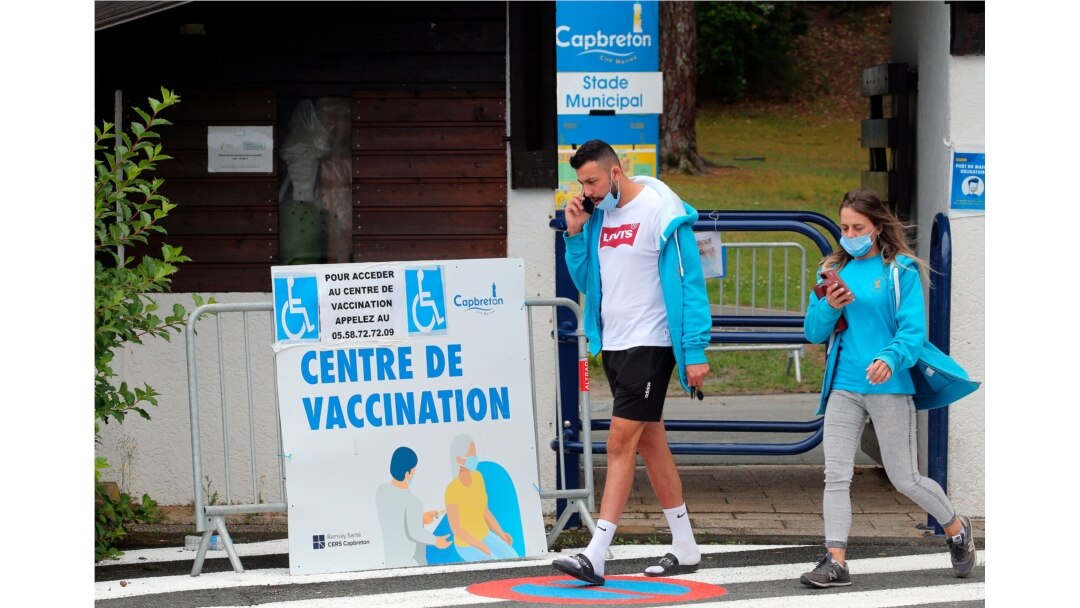 Residents leave a vaccination center in Capbreton, southwestern France, June 24, 2021. The delta variant, first identified in India, is estimated to represent 9 to 10% overall in France.